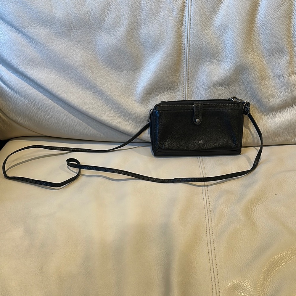 The Sak Black Minimalist Crossbody Bag with Flap Closure